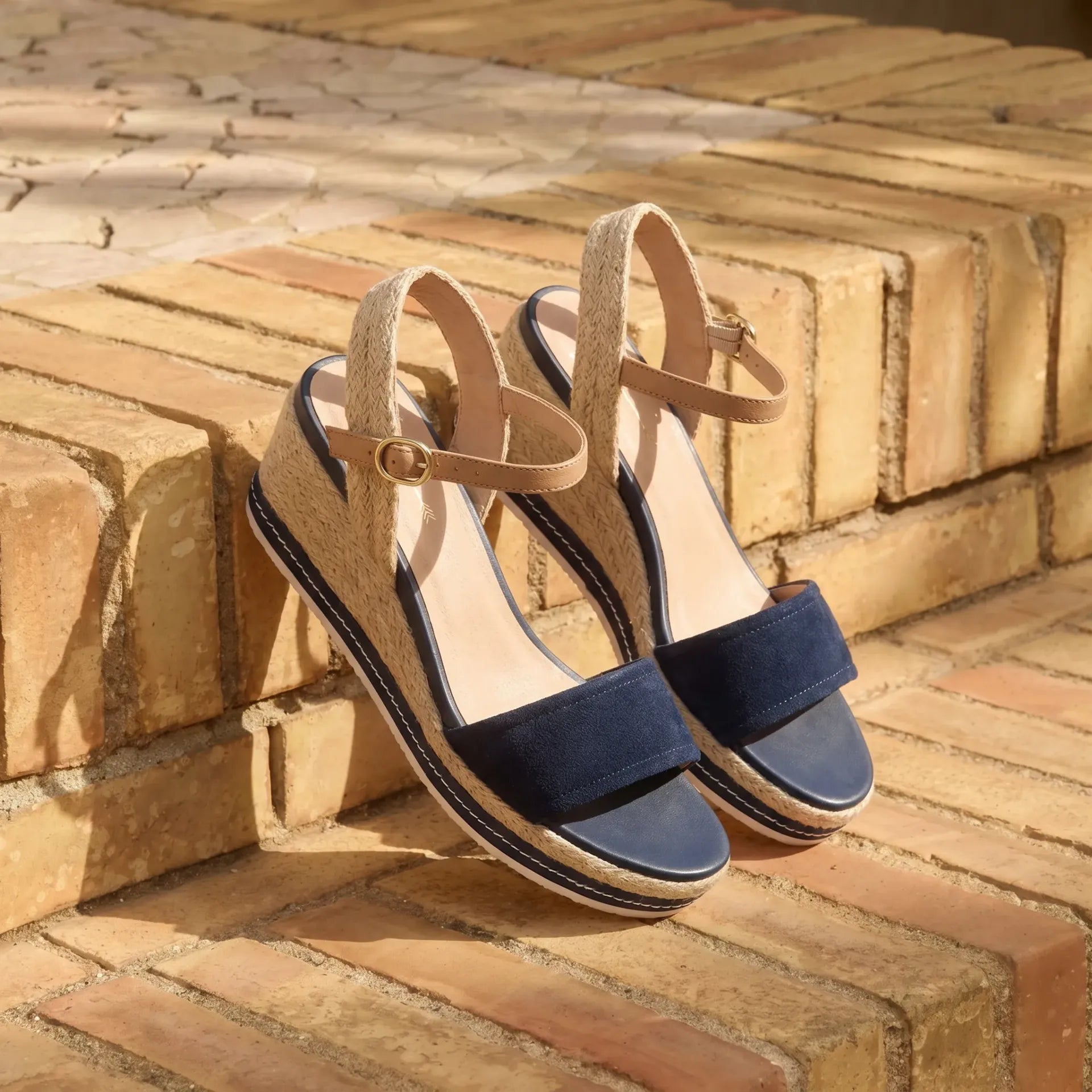 Harris Navy Suede espadrille wedge sandal still life on terracotta brick steps